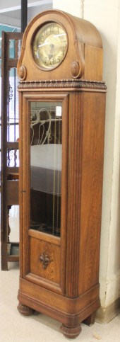 AN OAK TALL CASE FLOOR CLOCKAN