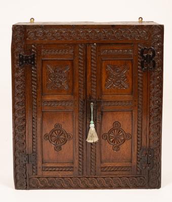 An oak wall hanging cupboard,