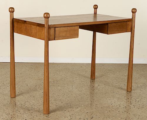 AN OAK WRITING DESK IN THE MANNER