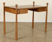 AN OAK WRITING DESK IN THE MAN