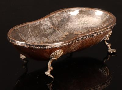 An oblong nut dish on scroll