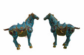 AN OLD PAIR OF CARVED WOODEN W