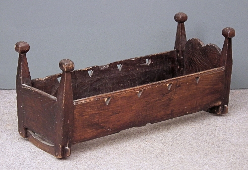 An old stained wood rocking crib