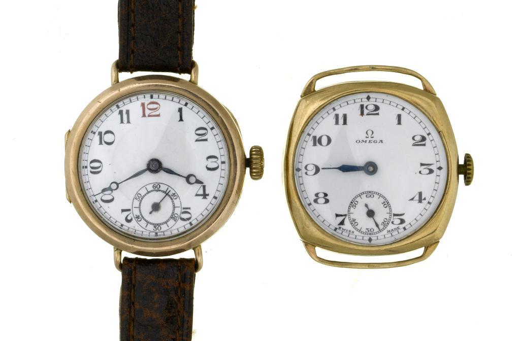 AN OMEGA 9CT GOLD CUSHION SHAPED