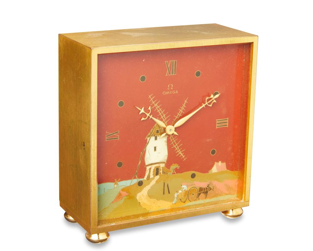 AN OMEGA WINDMILL TABLE CLOCKAn
