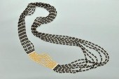 An Onyx Diamond and Gold Bead