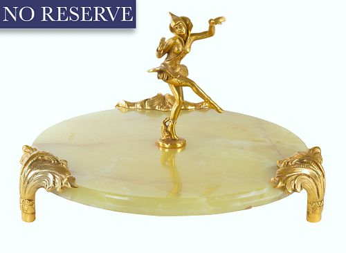 AN ONYX SCULPTURE WITH GILT JESTER,
