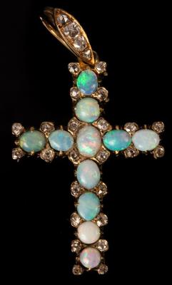 An opal and diamond set cross in an