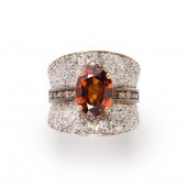AN ORANGE ZIRCON, DIAMOND AND