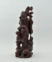 An Oriental Carved Wood Figura