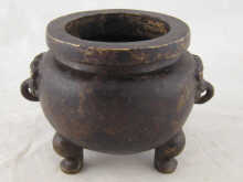 An Oriental censer on three feet