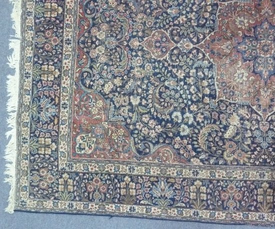 An Oriental rug with madder