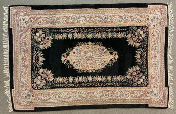 An oriental rug with pink central