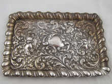 An ornate silver tray with