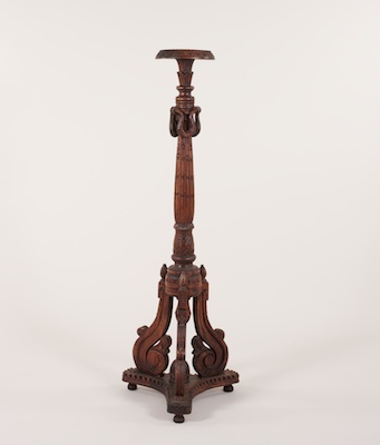An Ornately Carved Wood Pedestal