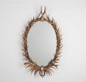 AN OVAL ANTLER FRAME MIRRORAn