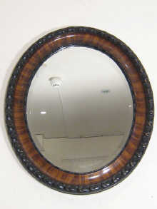 An oval bevelled mirror the