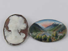 An oval brooch enamelled with a
