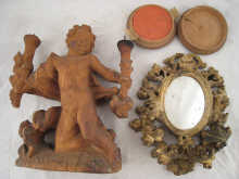 An oval mirror with elaborately