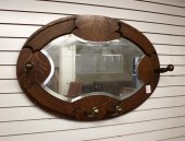 AN OVAL OAK-FRAMED GARMENT RAC