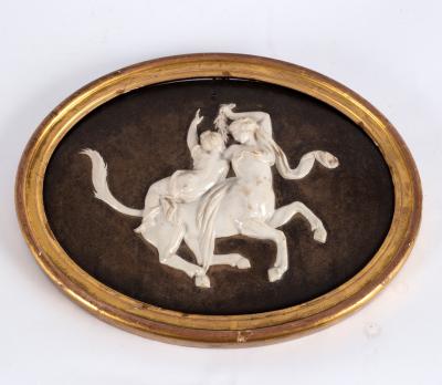 An oval porcelain plaque