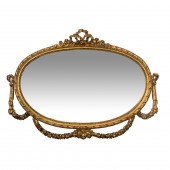 AN OVAL ROCOCO STYLE GILT LOOK