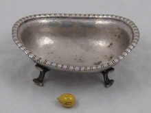 An oval silver footed dish with