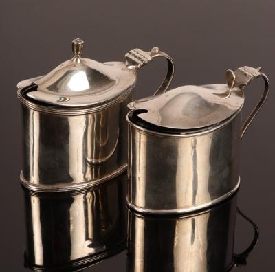 An oval silver mustard pot,