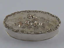 An oval silver trinket box