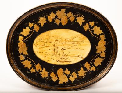 An oval toleware tray with a