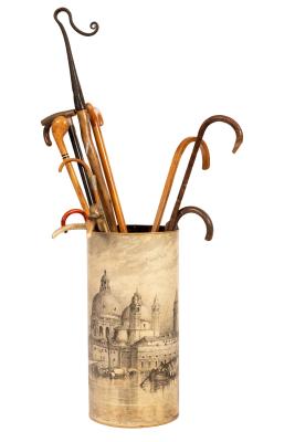 An oval umbrella stand decorated