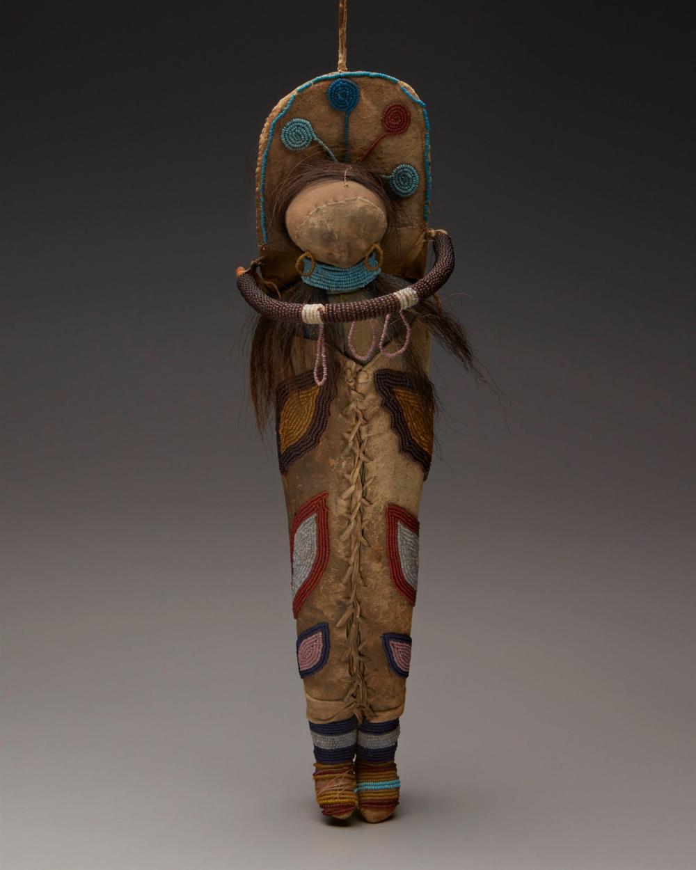 AN UMATILLA HIDE DOLL AND
