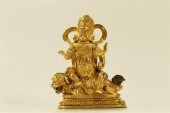 AN UNIQUE GILT-BRONZE FIGURE O