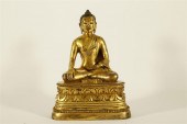 AN UNIQUE GILT-BRONZE FIGURE O