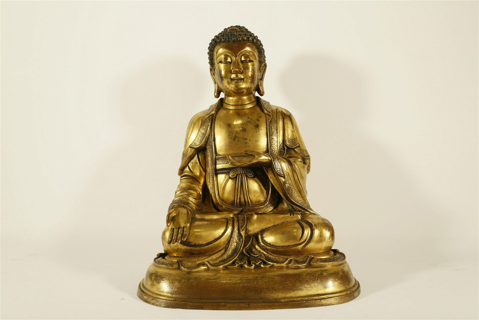 AN UNIQUE GILT-BRONZE STATUE OF