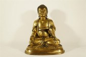 AN UNIQUE GILT-BRONZE STATUE O