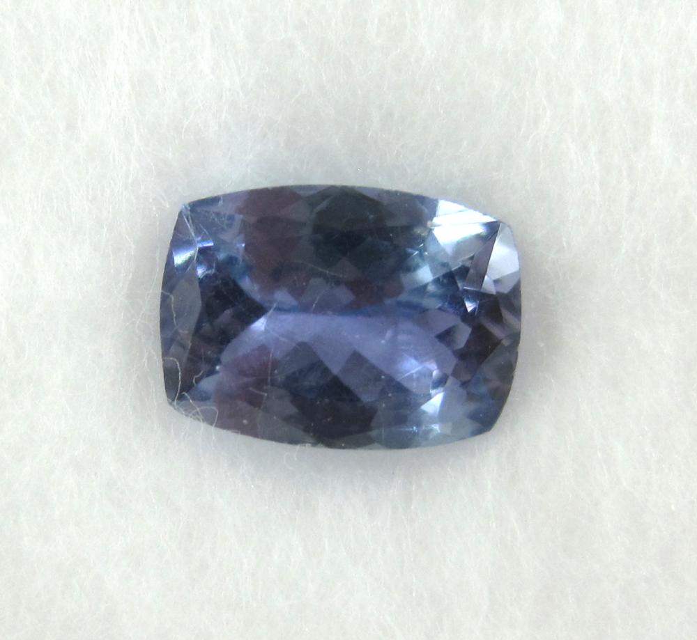 AN UNSET COLOR GEMSTONE, NATURAL