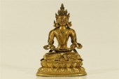 AN UNUSUAL GILT-BRONZE FIGURE