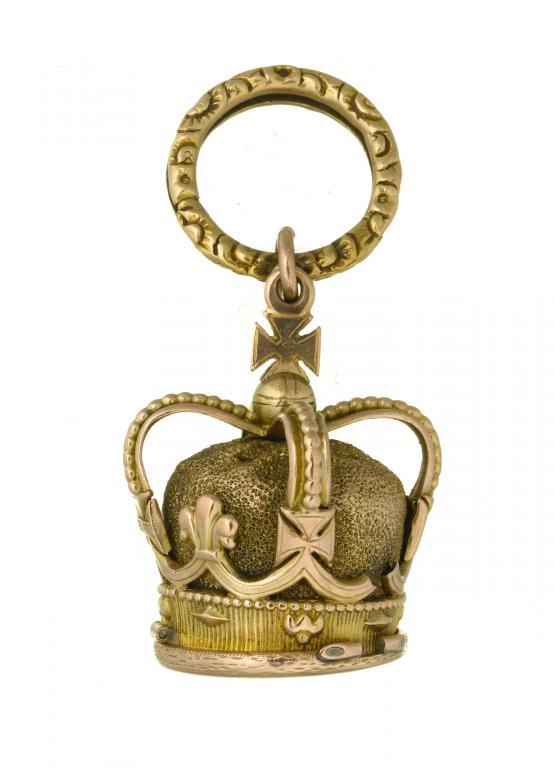 AN UNUSUAL GOLD SALTS BOTTLE IN THE
