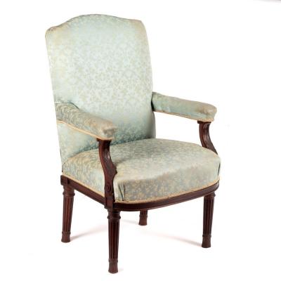 An upholstered armchair with