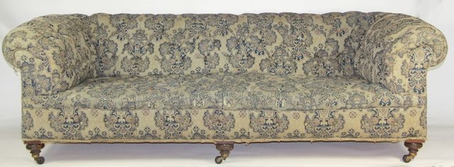 An upholstered Chesterfield sofa