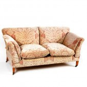 An upholstered settee by Howar