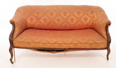 An upholstered sofa with scroll