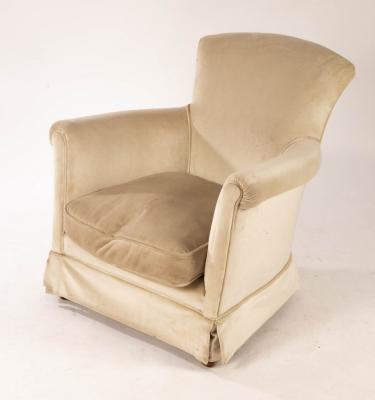 An upholstered tub-shaped chair, on