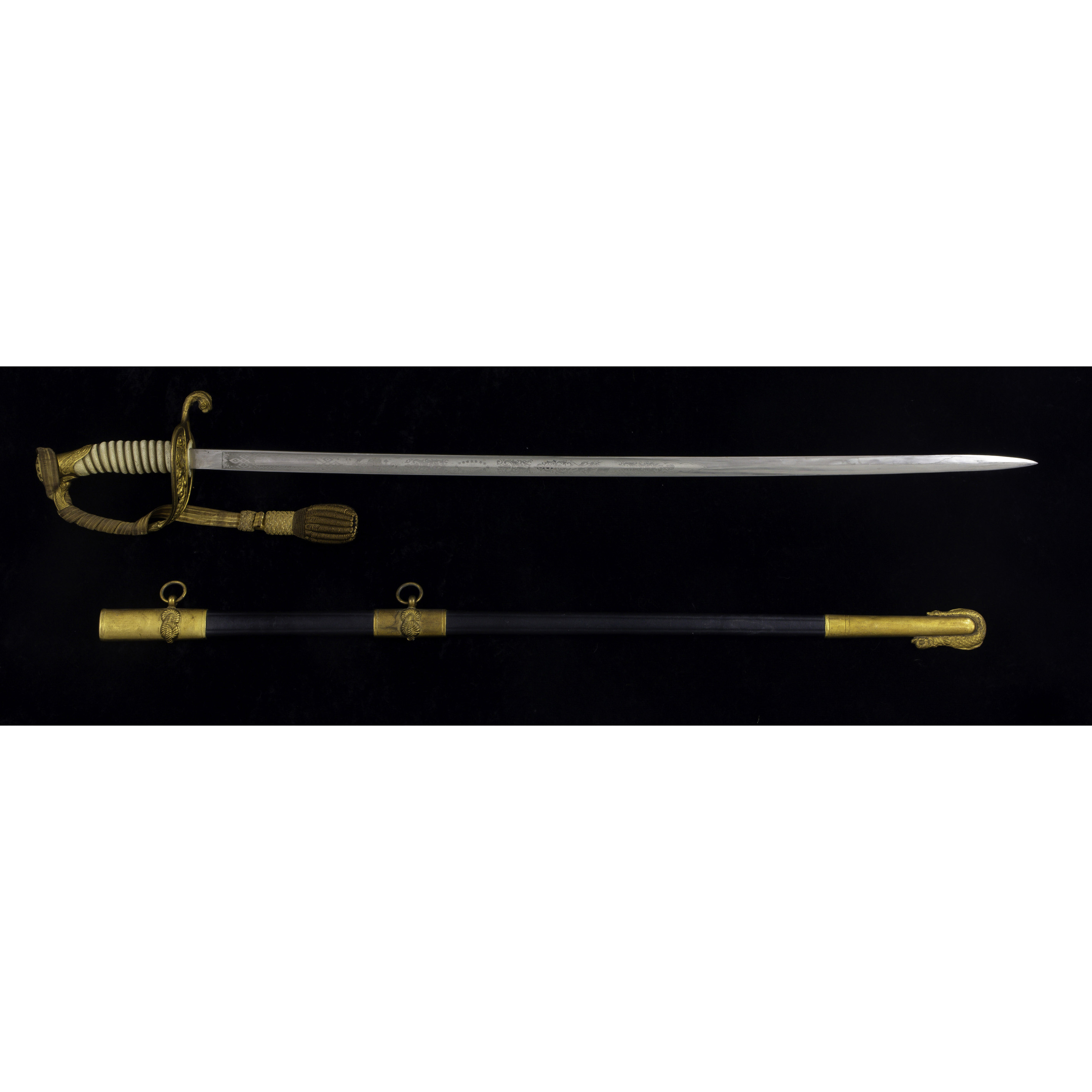 AN U.S.N. DRESS SWORD, RETAILED