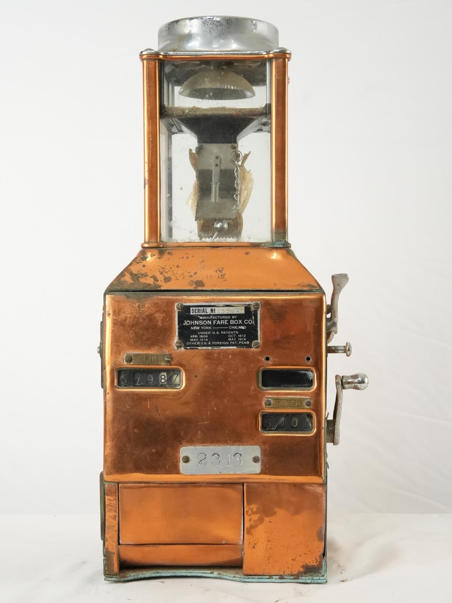 ANTIQUE BUS FARE TOKEN MACHINE IN