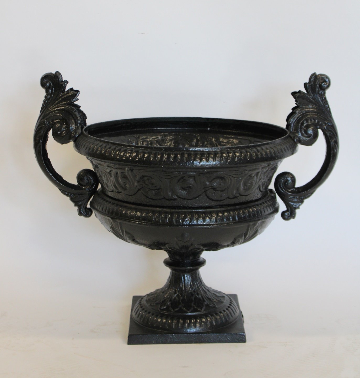 ANTIQUE CAST IRON URN ON STAND.