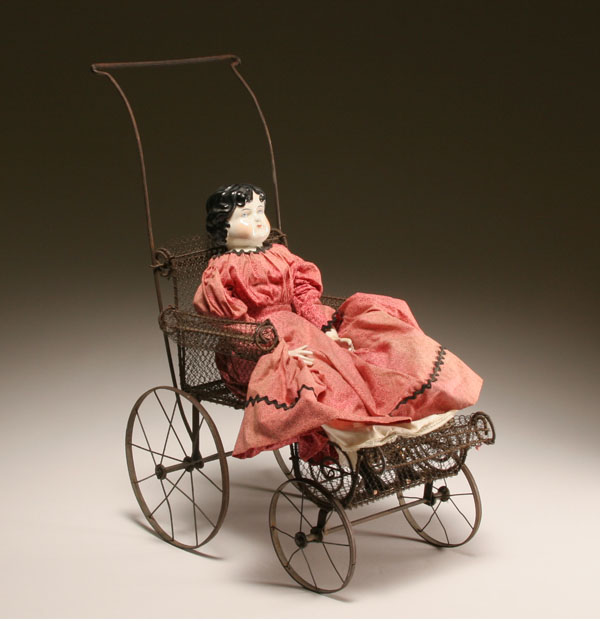 Antique China doll on Victorian