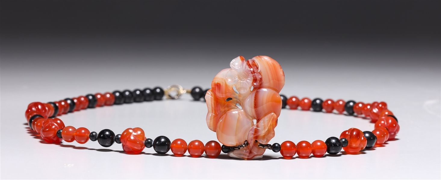 Antique Chinese carved agate bead