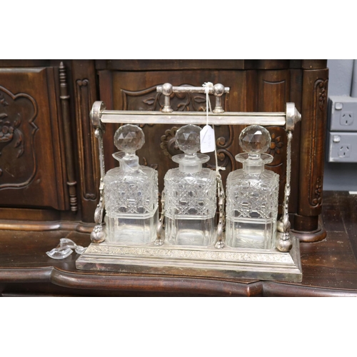 Antique English tantalus with three